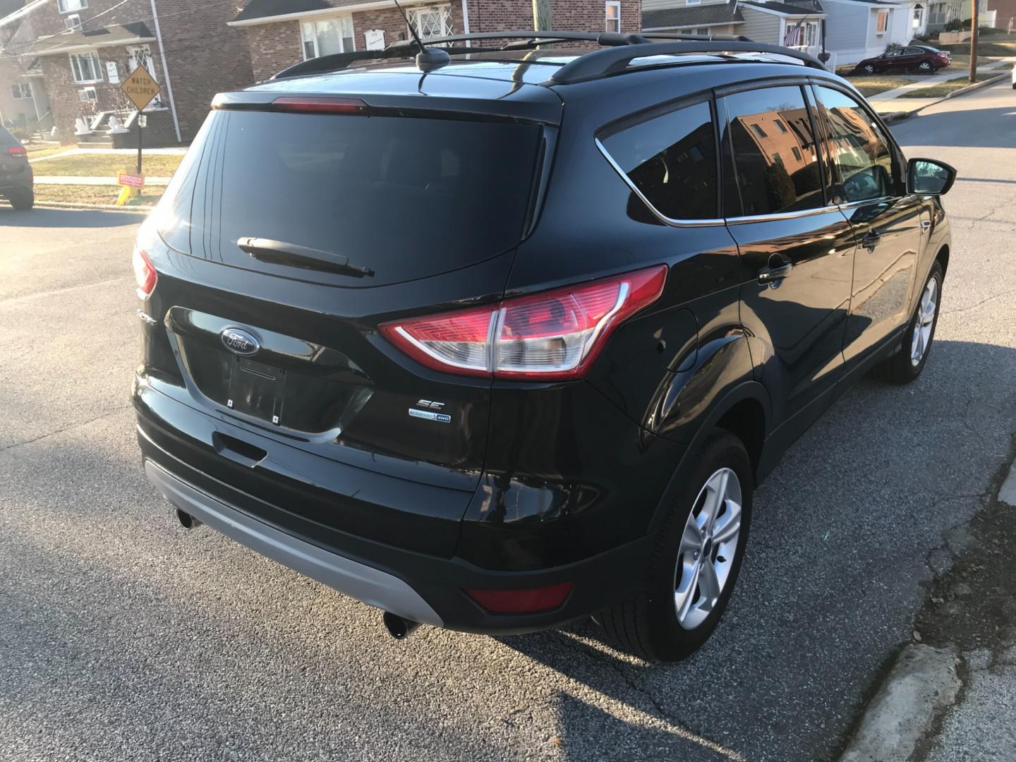 2013 Black /Black Ford Escape SE (1FMCU9G93DU) with an 2.0 V4 engine, Automatic transmission, located at 577 Chester Pike, Prospect Park, PA, 19076, (610) 237-1015, 39.886154, -75.302338 - Photo#4